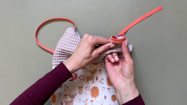 turning the baby bib right side out