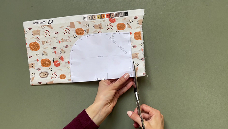 cutting the printed cotton fabric for the baby bib